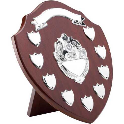 MAHOGANY SHIELD WITH CHROME FRONTS AND 9 RECORD SHIELDS (1in CENTRE) - 12.75in