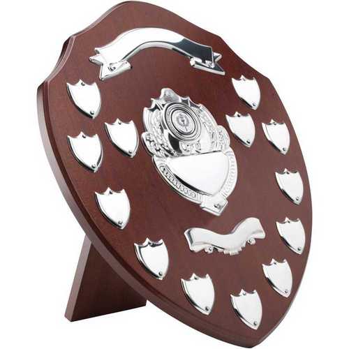 MAHOGANY SHIELD WITH CHROME FRONTS AND 13 RECORD SHIELDS (1in CENTRE) - 14in
